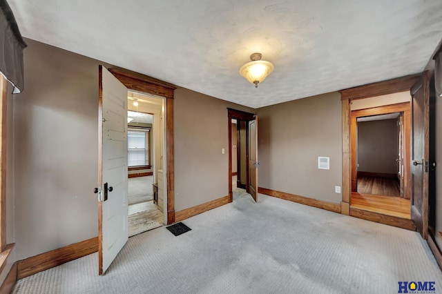 2524 S St, Lincoln, NE 68503 - unfurnished bedroom featuring light colored carpet and baseboards