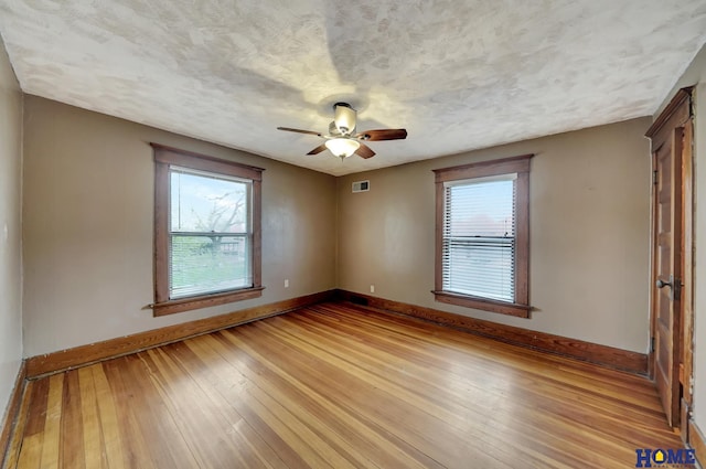 2524 S St, Lincoln, NE 68503 - empty room with light wood-type flooring, baseboards, and a ceiling fan