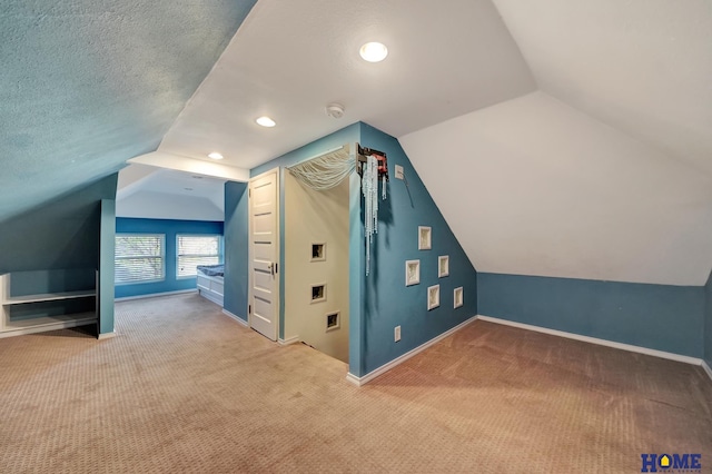 2524 S St, Lincoln, NE 68503 - bonus room featuring carpet, lofted ceiling, baseboards, and recessed lighting