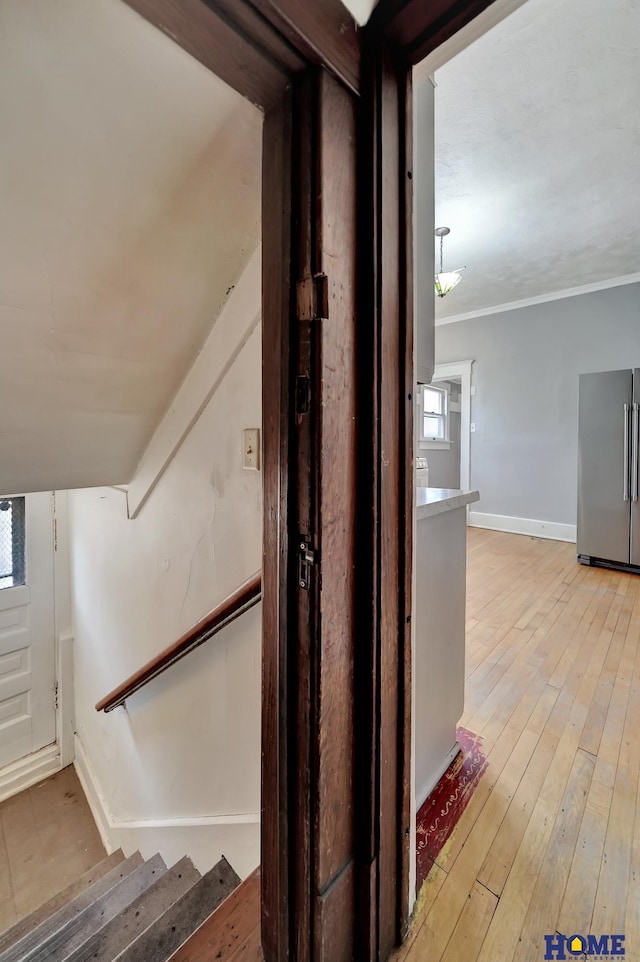 2524 S St, Lincoln, NE 68503 - stairway featuring baseboards, hardwood / wood-style flooring, and ornamental molding