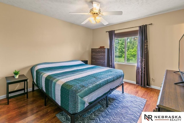 13518 Westport Cir, Bellevue, NE 68123 - bedroom featuring wood finished floors, baseboards, a textured ceiling, and a ceiling fan