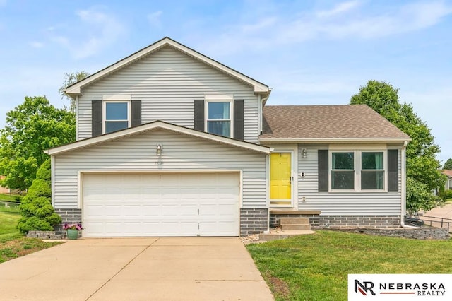 13518 Westport Cir, Bellevue, NE 68123 - tri-level home featuring a front yard, concrete driveway, an attached garage, and a shingled roof