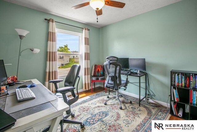 13518 Westport Cir, Bellevue, NE 68123 - office with ceiling fan, baseboards, a textured ceiling, and wood finished floors