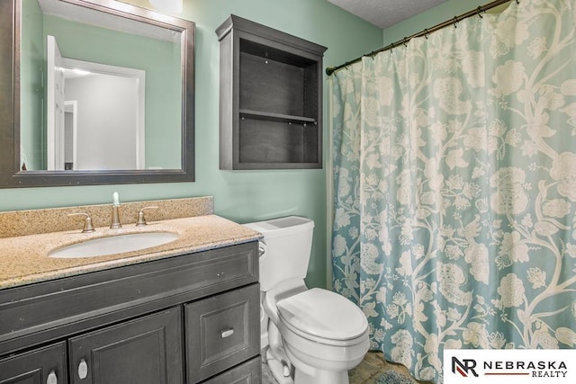 13518 Westport Cir, Bellevue, NE 68123 - bathroom with toilet, vanity, and curtained shower
