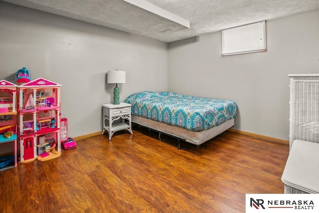 13518 Westport Cir, Bellevue, NE 68123 - bedroom with wood finished floors, a textured ceiling, and baseboards