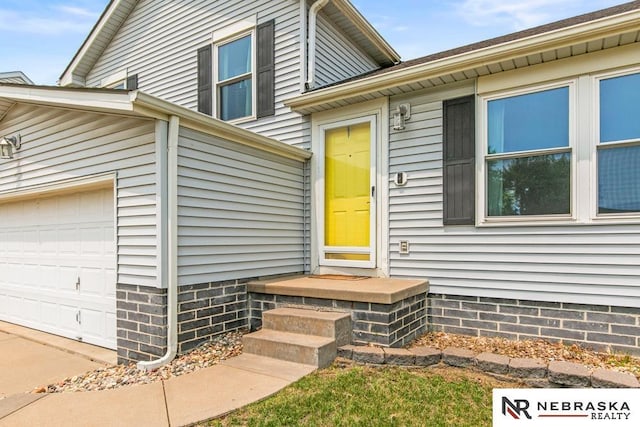 13518 Westport Cir, Bellevue, NE 68123 - view of exterior entry featuring an attached garage