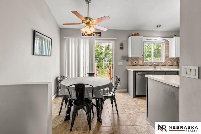 13518 Westport Cir, Bellevue, NE 68123 - dining space with plenty of natural light, ceiling fan, baseboards, and light tile patterned flooring