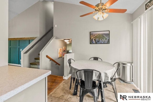 13518 Westport Cir, Bellevue, NE 68123 - dining room featuring a ceiling fan and stairway
