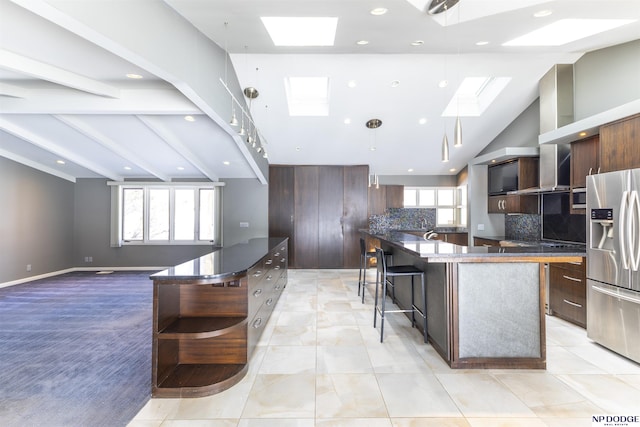 10615 Martha St, Omaha, NE 68124 - kitchen with a skylight, stainless steel fridge, open shelves, modern cabinets, and lofted ceiling
