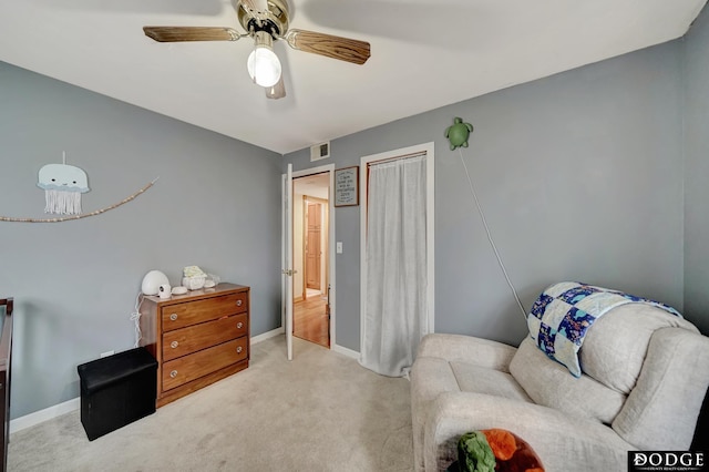 3317 N 9th St, Lincoln, NE 68521 - living area with carpet, baseboards, and ceiling fan