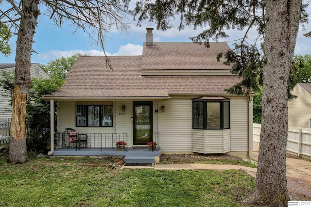 4459 F St, Omaha, NE 68107 - view of front of property featuring covered porch, a chimney, and roof with shingles