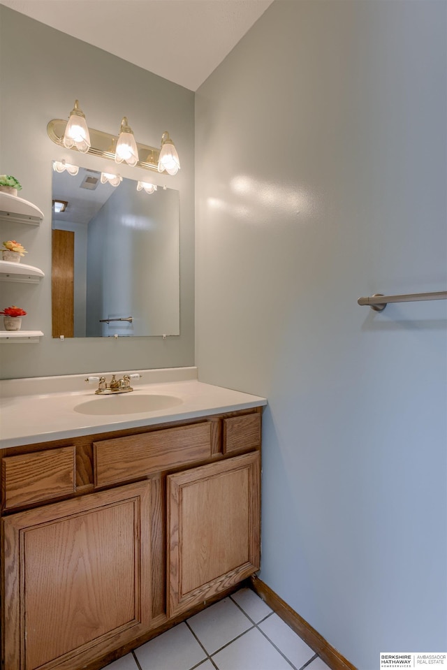 4459 F St, Omaha, NE 68107 - bathroom with vanity, tile patterned floors, and baseboards