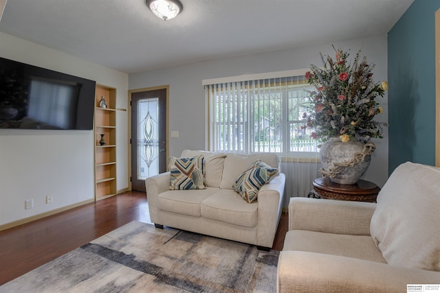 4459 F St, Omaha, NE 68107 - living area with wood finished floors, built in features, and baseboards