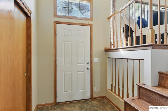 8853 N 82nd Ave, Omaha, NE 68122 - foyer entrance with baseboards, stone finish floors, and stairs