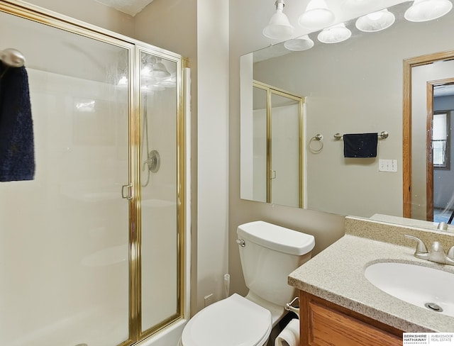 8853 N 82nd Ave, Omaha, NE 68122 - full bathroom featuring a stall shower, vanity, and toilet