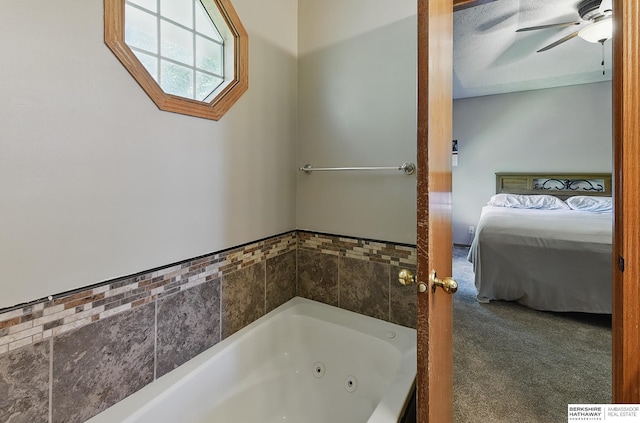 8853 N 82nd Ave, Omaha, NE 68122 - bathroom with ensuite bath, a jetted tub, and a ceiling fan