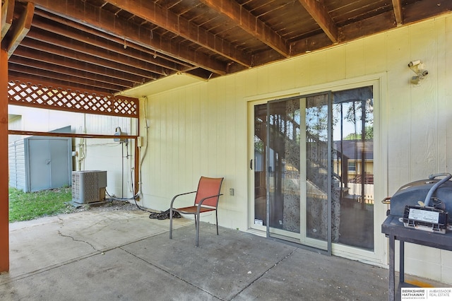 8853 N 82nd Ave, Omaha, NE 68122 - view of patio featuring central AC unit and grilling area