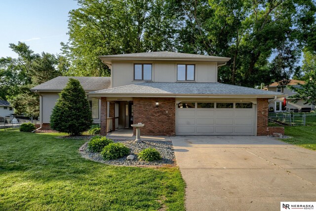 2223 S 161st Cir, Omaha, NE 68130 - view of front of home with concrete driveway and an attached garage