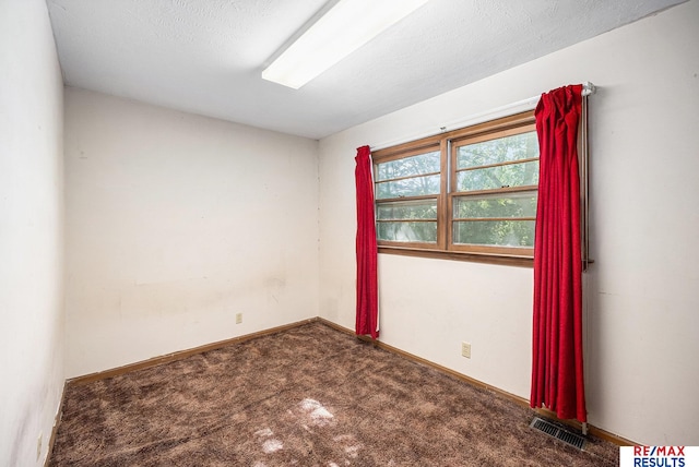 5704 N 68th St, Omaha, NE 68104 - spare room featuring carpet flooring and baseboards