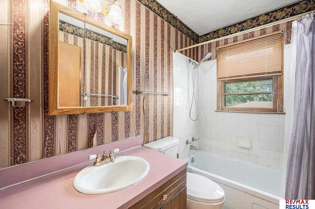 5704 N 68th St, Omaha, NE 68104 - bathroom featuring toilet, shower / bath combination with curtain, wallpapered walls, and vanity