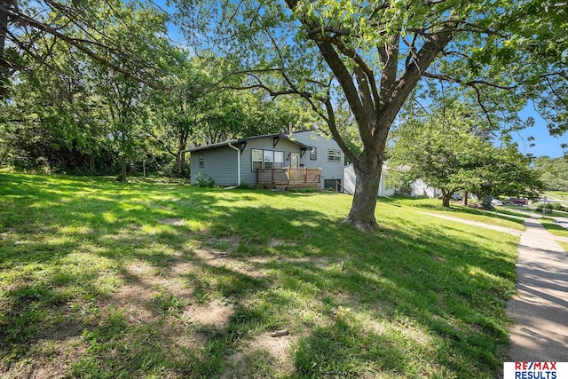 5704 N 68th St, Omaha, NE 68104 - view of grassy yard featuring a deck