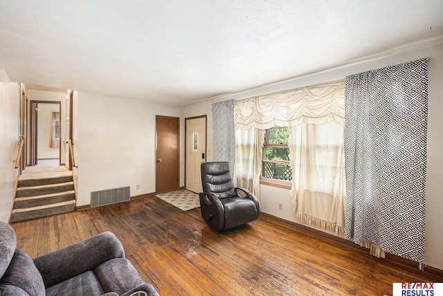 5704 N 68th St, Omaha, NE 68104 - living room featuring hardwood / wood-style flooring, stairs, and baseboards