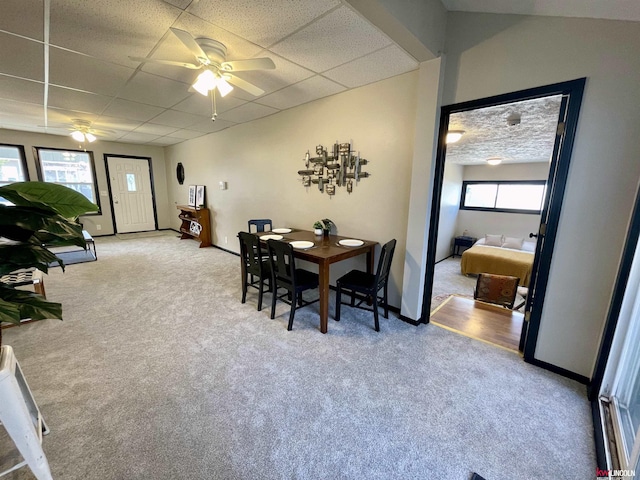 1402 Rose St, Lincoln, NE 68502 - dining space featuring carpet flooring, a ceiling fan, a paneled ceiling, and baseboards