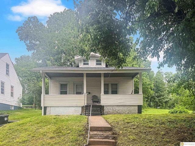4525 N 41st St, Omaha, NE 68111 - bungalow-style home featuring a porch and a front yard