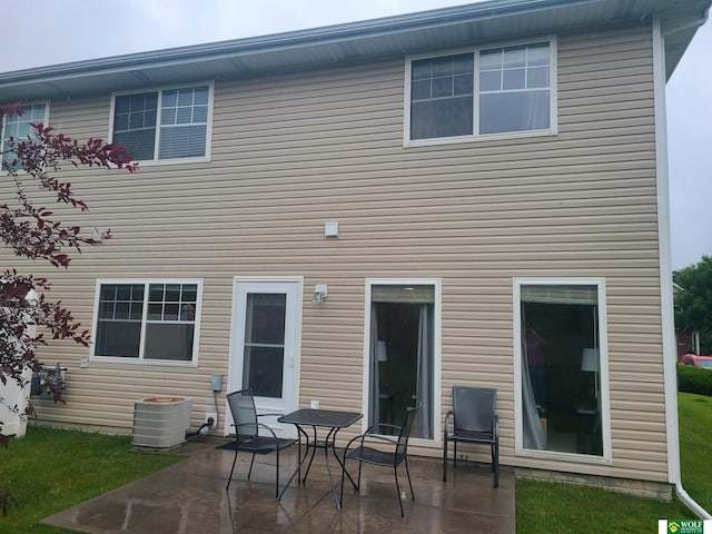 1730 Sawyer St, Lincoln, NE 68505 - rear view of house featuring a patio area and central AC unit
