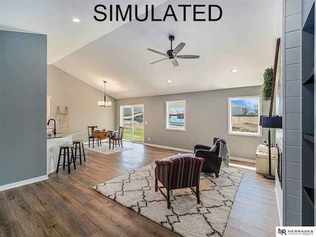 4048 Northview Dr, Grand Island, NE 68803 - living area with wood finished floors, recessed lighting, a chandelier, vaulted ceiling, and baseboards