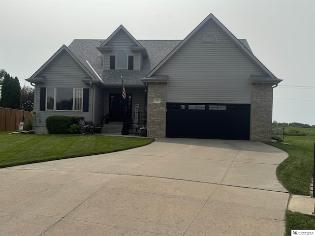 13410 Highlander Pl, Waverly, NE 68462 - view of front of house featuring driveway, brick siding, roof with shingles, and an attached garage