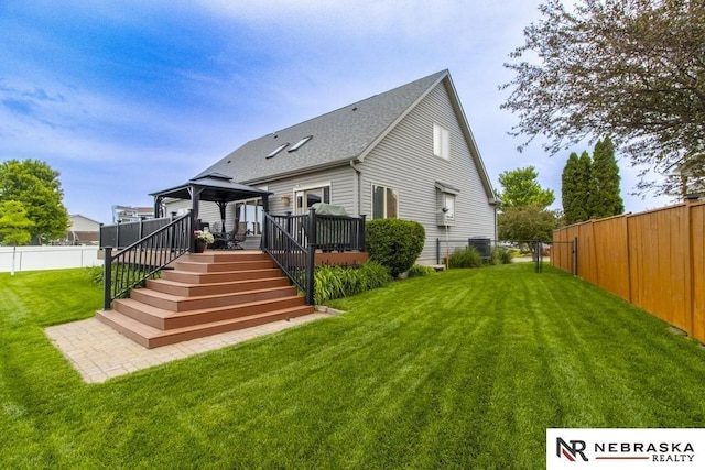 13410 Highlander Pl, Waverly, NE 68462 - rear view of house with a gazebo, a deck, a fenced backyard, and a shingled roof