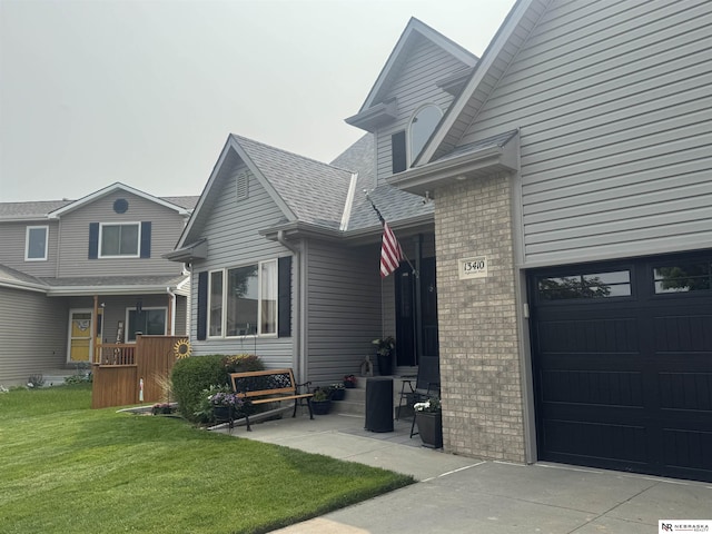 13410 Highlander Pl, Waverly, NE 68462 - view of side of home featuring a garage, a yard, and brick siding