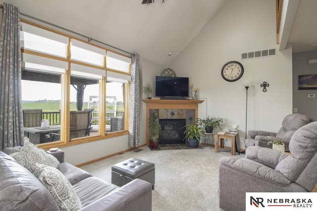 13410 Highlander Pl, Waverly, NE 68462 - carpeted living room featuring high vaulted ceiling and a tile fireplace