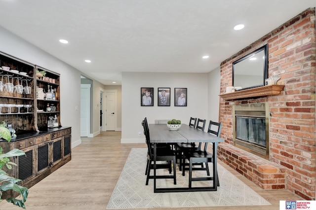 631 Overlook Ln, Beatrice, NE 68310 - dining room with wood finished floors, recessed lighting, baseboards, and a fireplace