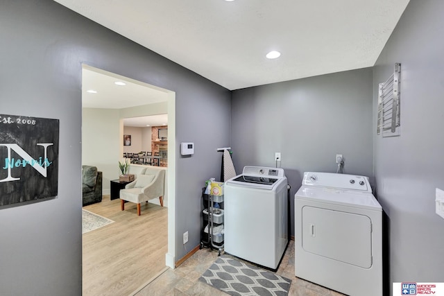631 Overlook Ln, Beatrice, NE 68310 - laundry room featuring washer and dryer, baseboards, and recessed lighting