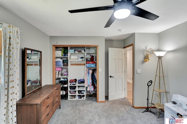631 Overlook Ln, Beatrice, NE 68310 - carpeted bedroom with a closet, ceiling fan, and baseboards