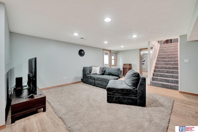 631 Overlook Ln, Beatrice, NE 68310 - living room featuring stairway, recessed lighting, baseboards, and wood finished floors
