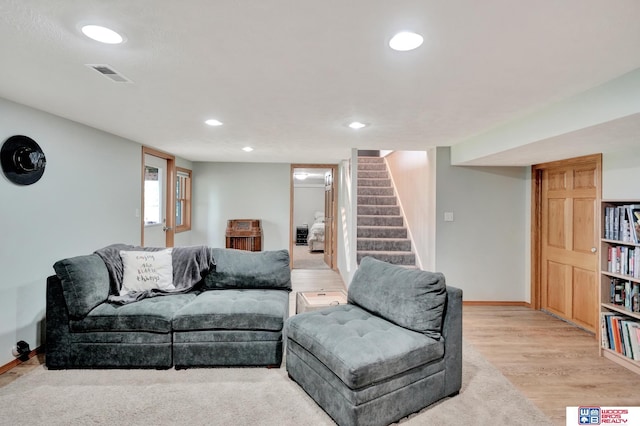 631 Overlook Ln, Beatrice, NE 68310 - living room with baseboards, stairs, recessed lighting, and light wood-style floors