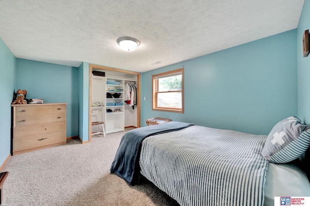 631 Overlook Ln, Beatrice, NE 68310 - bedroom with a closet, carpet floors, and baseboards