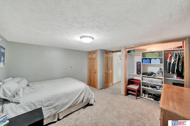 631 Overlook Ln, Beatrice, NE 68310 - bedroom featuring carpet flooring and a textured ceiling