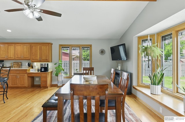 2442 E 2nd St, Fremont, NE 68025 - dining area with light wood-type flooring, baseboards, a ceiling fan, recessed lighting, and vaulted ceiling