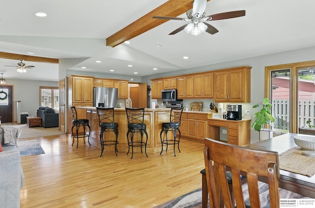 2442 E 2nd St, Fremont, NE 68025 - kitchen featuring stainless steel appliances, a ceiling fan, plenty of natural light, recessed lighting, and light wood-style floors