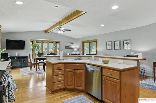 2442 E 2nd St, Fremont, NE 68025 - kitchen featuring dishwasher, a sink, light countertops, plenty of natural light, and recessed lighting