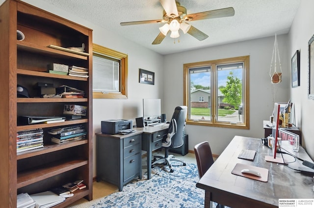 2442 E 2nd St, Fremont, NE 68025 - office space featuring a ceiling fan, a textured ceiling, and light carpet