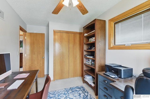 2442 E 2nd St, Fremont, NE 68025 - home office featuring ceiling fan and a textured ceiling