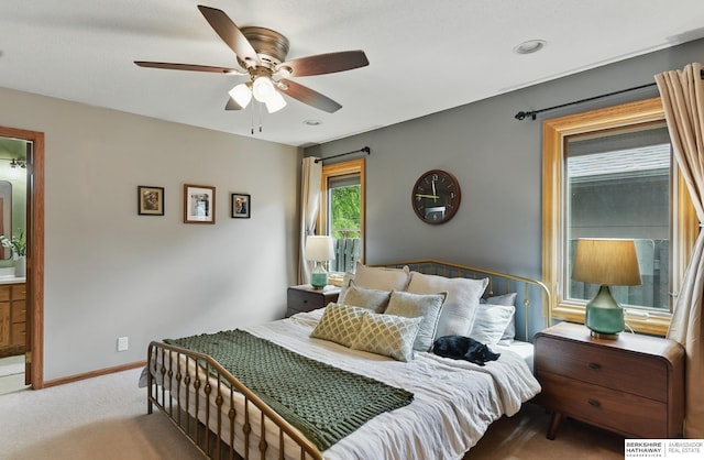2442 E 2nd St, Fremont, NE 68025 - carpeted bedroom with ceiling fan, baseboards, and ensuite bath