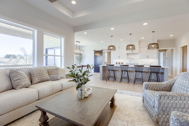 4093 George B Lake Pkwy, Omaha, NE 68022 - living room featuring recessed lighting, light wood finished floors, and a barn door