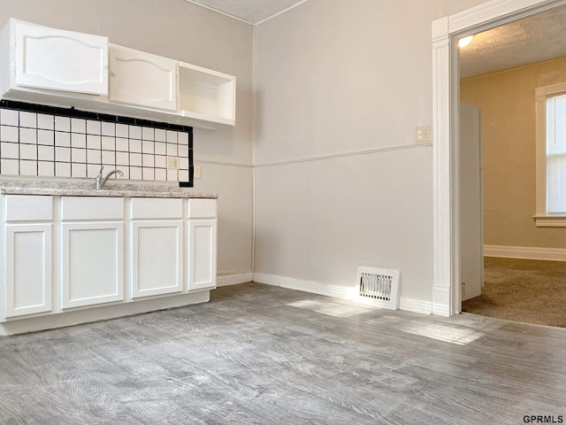 3719 X St, Omaha, NE 68107 - unfurnished dining area with baseboards