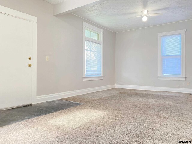 3719 X St, Omaha, NE 68107 - unfurnished room featuring carpet flooring, a ceiling fan, a textured ceiling, and baseboards